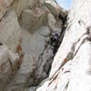 Almost to the crux of the fourth pitch. Fifteen feet above you see a small roof that you transition out right around.