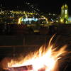 Wheelbarrow bonfire on the 5th floor terrace of the Secret Garden hostal, Old Town Quito, Ecuador.