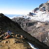 Nancy Bell takes a break on the way up Illiniza Norte, with Illiniza Sur looming large behind her.