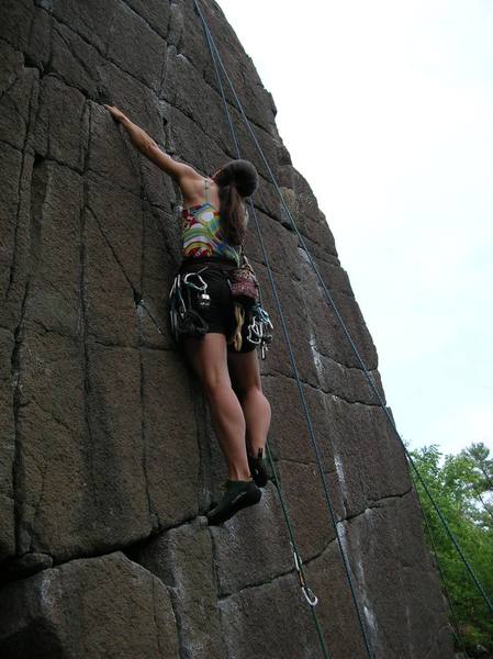 Not the best photo with the top rope hanging in the background, but somebody needs to put in some photos of folks climbing at the Falls. Sue just above the crux of #6.