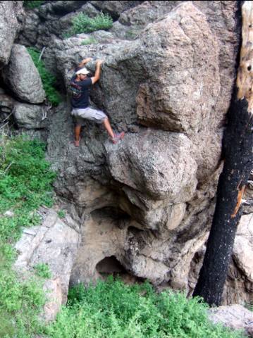 Miguel engaging in some exposed Clifty bouldering.