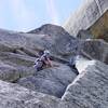 Looking past the wide section towards the crux. The wide crack can be protected with a blue Camalot. A bigger cam can be placed higher. The wide section is easier and shorter than it looks.