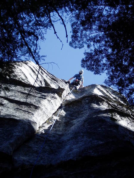 When the crack runs out, keep going on easier dike climbing to a very comfortable bolt belay on a huge dike.