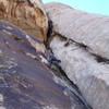 Jonny on the chimney/roof pitch. <br>
We climbed this route in 5 pitches with some simul-climbing.<br>
<br>
(Taken 10/3/07)