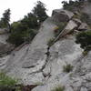 Slippery Slope Crack Pitch #10 during the FA. The trees and veggies are now gone. Belay at the left corner of the roof. All gear.