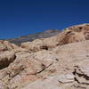 A view from the top of the notch behind Wake Up Wall. The brown face in the bottom left of the photo is Up and Down (5.10c). The prominant boulder in the upper right is the Walrus.