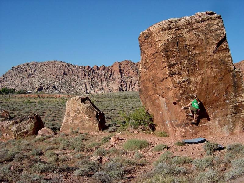 The Cube is the first boulder you come upon if you just walk straight from the parking area on the road back towards the hills (north).  It's enormous.  Perfect Poser is a nice highball warmup.