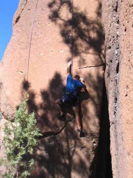 The left hand is in the Tweakiest Mono at Cochiti, and the right hand is in also-difficult sloping two-finger pocket.