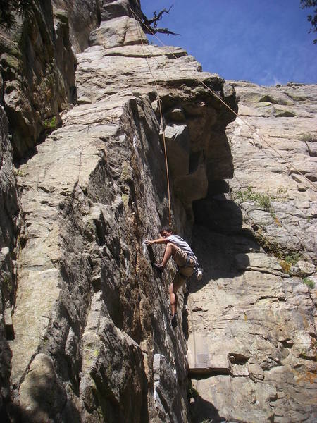 Robbie TRing through the lower crux's thin moves