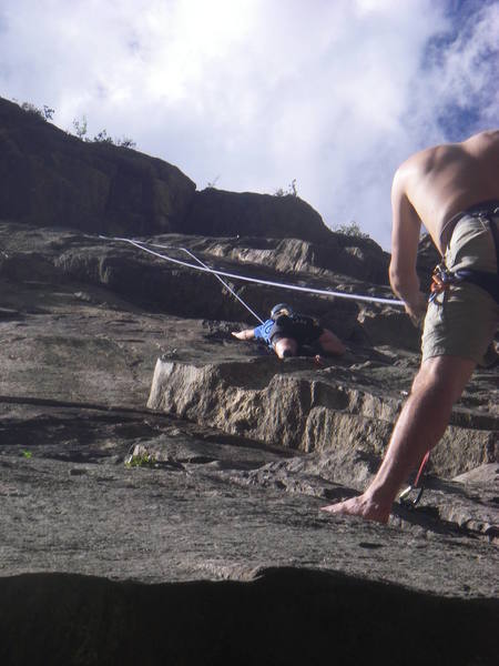 Me belaying lil sis up Guppy.  Notice that I'm 10 feet above the pod on at a hanging belay because a 60m ROPE WILL NOT REACH THE POD.