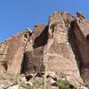 The west face of The Fortress sits high above and overlooks the Peralta Trail.