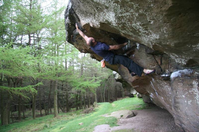 Mike making the crux move on The Sorcerer, 5.10d (E1, 5c).