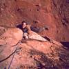 Tony Bubb climbs Lightning Bolt Cracks (5.11) on Indian Creek's North Six Shooter. This was done in Joseffa's approach shoe after arriving and realizing I'd forgotten my climbing shoes. Photo by Joseffa Meir, 2002.