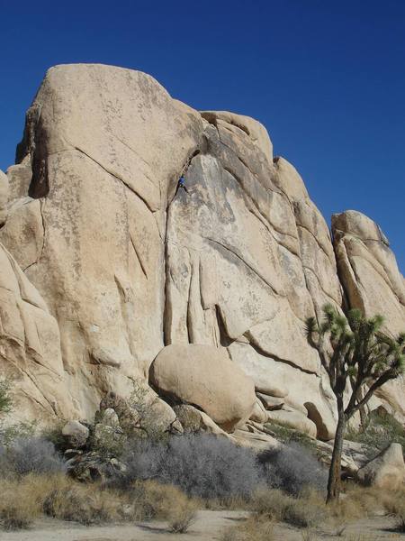 Climber on the route [[105722170]] of the Old Woman's west face