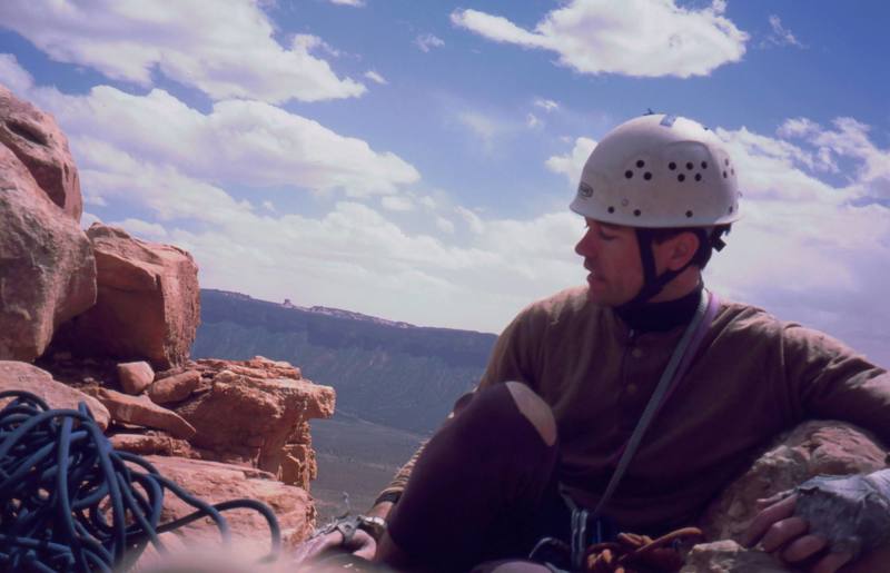 Tony Bubb on the summit of 'The Priest' is Castle Valley. Photo by Joseffa Meir, 2003.