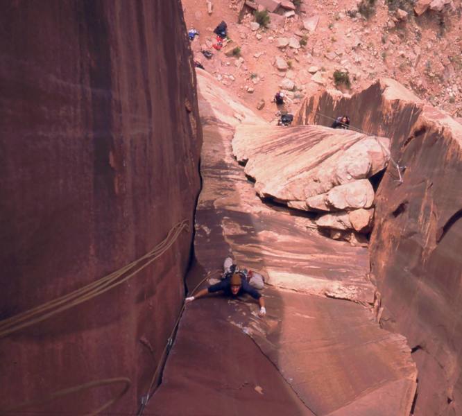 Dave further up 'The Fuzz (5.10)' at Way Rambo Wall in Indian Creek.  Joseffa Meir can be seen warming up just to the right on 'Rochambeau (5.9+).' Photo by Tony Bubb, 2005. 