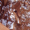 Looking down at Ben at the second rappel's anchors in the notch from the rappel off Luminous Being. This rappel is used to get off both towers. 