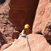 Larissa coming up to the third belay ledge after the 5.8 mud chimney. 