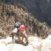 Aron finishing up P3 into a nice "belay dish" just right of the bushy gully that is frequently belayed from. 