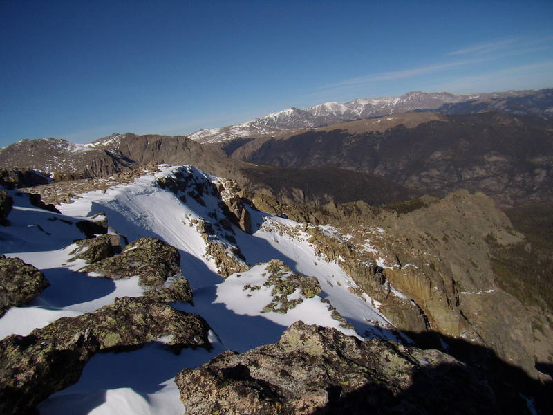 Summit of NE face on Notchtop looking north.  Firm snow, small cornices and our foot tracks.  Nov 3rd. 2007.