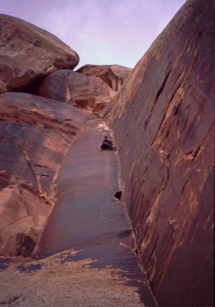 Tony Bubb rides out the finish to Blue Gramma (5.11) at Blue Gramma cliff in Indaina Creek. A fine obtuse corner. Photo by Trey or John, 2006.