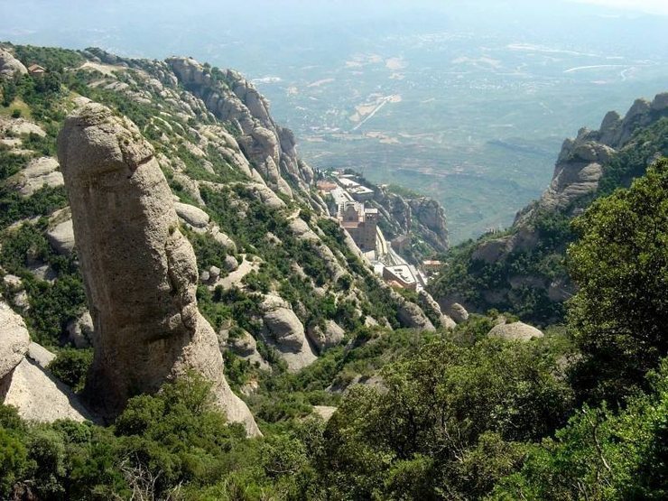 One of the many really cool conglomerate towers near the monestary at Montserrat ("Serrated Mountain").  Saw some guys leading this tower with nuts for pro.  Whew.  The monestary is in the background.