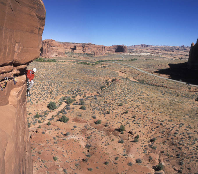 Jeff Widen enjoying the ambiance on the exposed second pitch traverse.