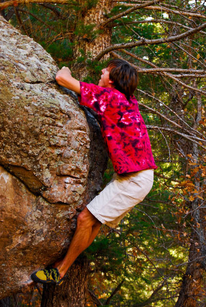 Stephen at the top of the crux trying to get over the bulge. 