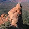 This spire is found below the start of the Sedona Scenic Cruise.  It's an easy scramble from the notch to the top and is fun to do if you've got extra time.  Two Sedona spires in a day!  Yipee!