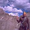 King of the Mountain, or just Burger King? Tony Bubb wields the ruling scepter of the #5 HB quadcam and the royal crown on the summit of the Spearhead. Longs Pk and Mt. Pagoda are in the Background. Photo by Joseffa Meir, Y2K.