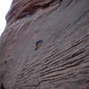 Perin Blanchard at the second bolt on <em>Pins and Needles</em>. The crux is about 15 feet ahead.