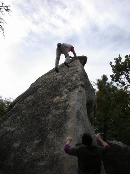 Chris topping out the arete on the Elephant man boulder at Southridge.