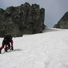 Heading up to the steepest and narrowest section of the initial snow field.  Photo by Ted, August 2007.