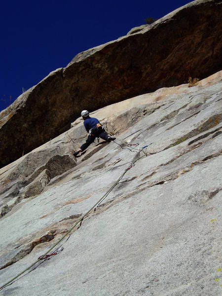 After the crux and clipping the 4th bolt, Luke is looking left towards the anchors.