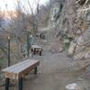 Benches and fence along hill at base of "Family Friendly" Draper Red Rock