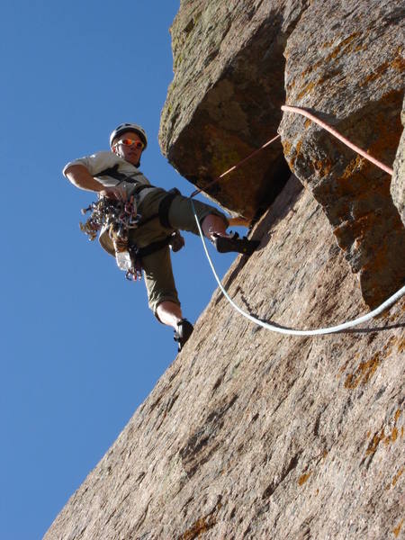 Finishing the undercling crux on pitch two