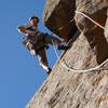 Finishing the undercling crux on pitch two