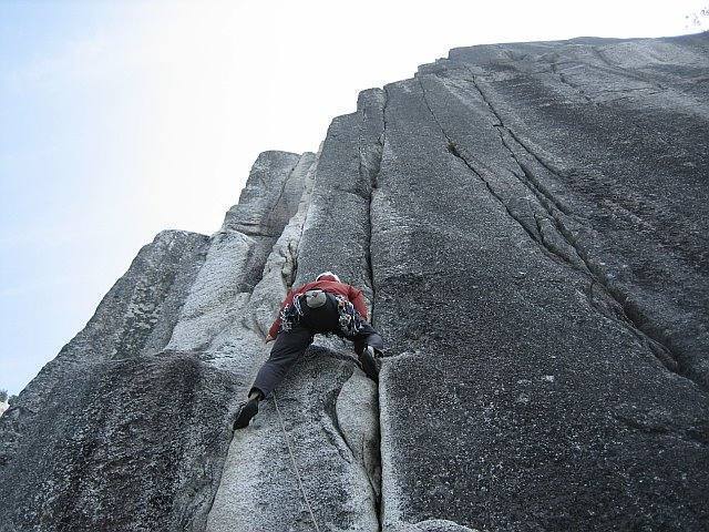 Picture By Harvey Miller<br>
John Bradford leading the crux pitch on the Squamish Buttress The main corner is to the left.<br>
The line straight up is 5.12A