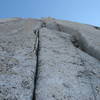 The first pitch of the Great White Headwall climbs a short 5.10 offwidth/fist crack, then up these steep 5.9 cracks to the belay