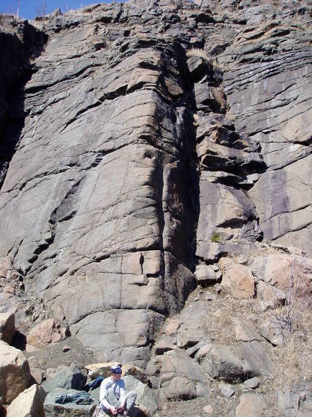 Racking up for a slopey arete climb