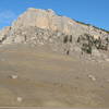 Steamboat Point seen from Highway 14. The trail can barely be seen running diagonal uphill from left to right. The Moderate Wall is the large gray slab to the right of the tallest prow (with shaded roof at top) in the center of the cliff.