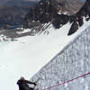 Kia on the snow field below the summit of North Palisade via Clyde Couloir.