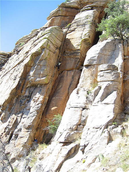 Erica Bigio cruising the crux.  On a warm day this and the dihedral in the middle of the cliff go into the shade so you can keep climbing when the faces may seem too warm.