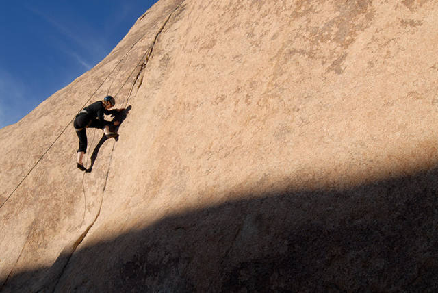 Brooke Peterson climbs through the crux sequence of Pinky Lee, in Echo Cove.