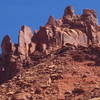 South Six Shooter.  Directly below the apparent high point in the photo is a smooth face split by a left-angling crack.  This variation goes at approx. 5.10a/b and a second pitch will take you straightforwardly to the summit.  Standard route is to the left in the shadows.  Other variations exist  to the right.