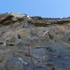 Approaching the capping overhang on Double Whammy, 5.11b.