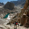 Etsuko is negotiating sandy ledges and gullies low on the East Buttress of Mt. Muir. Wotan's Throne is in the background - July 24, 2004