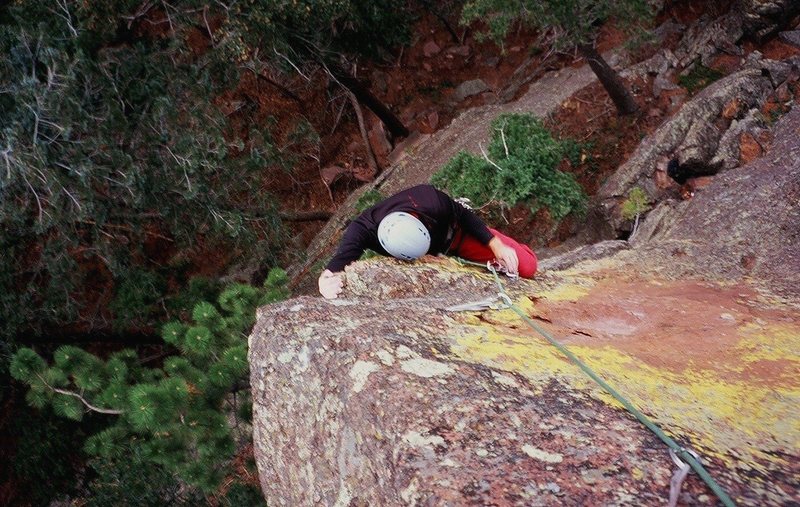 Max Seigal gets the crux jugs on 'Dangling Fury (5.11)' on skunk Canyon's 'Lingum' formation, in the Flatirons. Photo by Tony Bubb, 11/07.