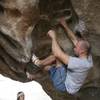 Mike starting the crux sequence on Caveman, V7