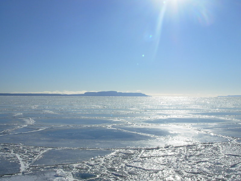 The pennisula in the distance is Sleeping Giant Provincial Park. Sleeping Giant along with a number of other areas in the Thunder Bay region have an enormous amount of new route potential.  Sleeping giant sports the only "alpine" route in the province.  Discovery, 5 pitch II 5.7.